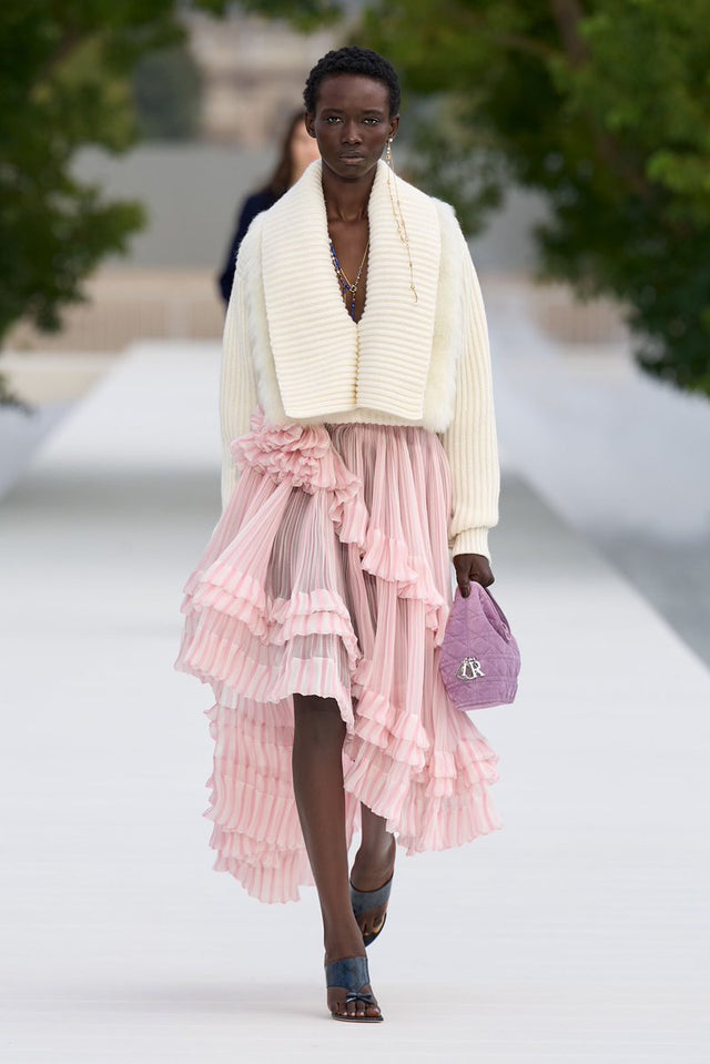 Dior SS27 runway undone bra under open jacket look Paris Fashion Week